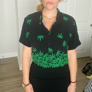 Spencer's Black Shirt with Green Leaf Design